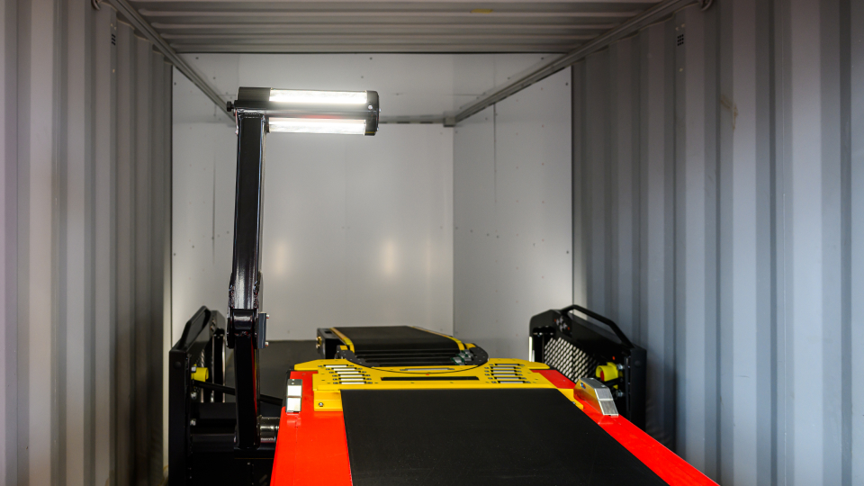Overhead light installed on Caljan telescopic conveyor for better visibility inside the trailer